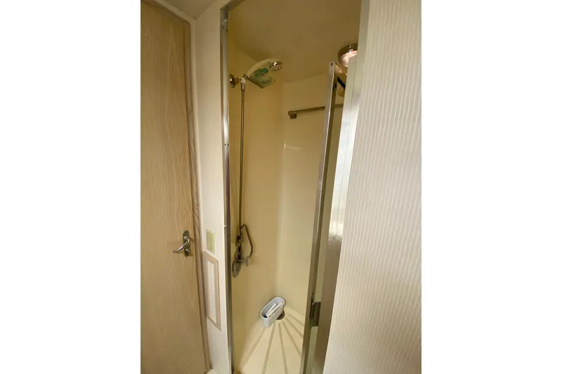 Slide: The Image of Shower area in 1995 Hatteras 50 Convertible Sportfish yacht, featuring a sleek design. - 60