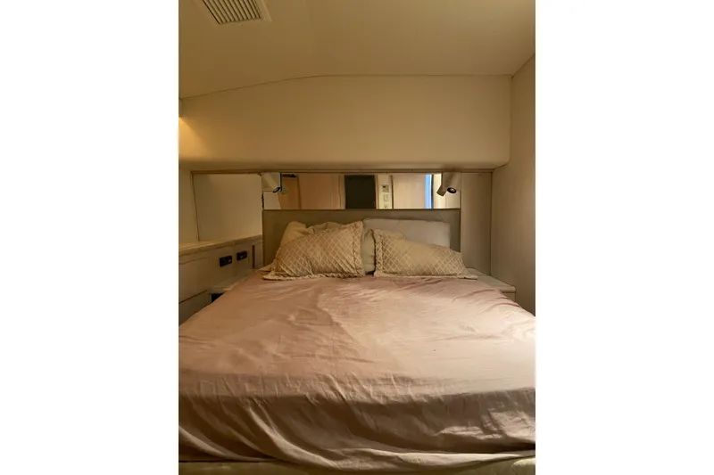 Slide: The Image of Cozy bedroom interior of 1995 Hatteras 50 Convertible Sportfish yacht. - 61
