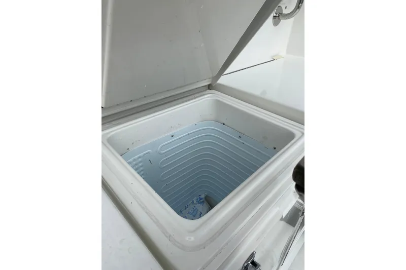 Slide: The Image of Open storage compartment on 1995 Hatteras 50 Convertible Sportfish boat. - 30