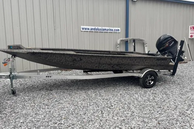 The Image of 2026 Xpress X18DB boat on trailer, parked outside Andalusia Marine building. - 0