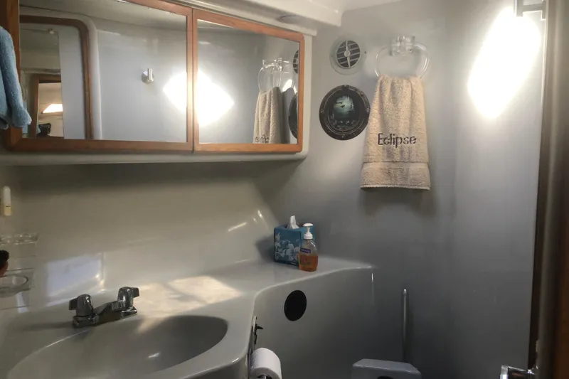 Slide: The Image of Bathroom interior of 1990 Sea Ray 440 Express yacht with mirror and sink. - 20