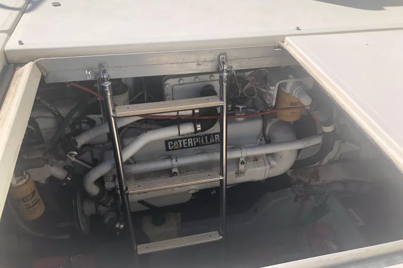 Slide: The Image of Engine compartment of 1990 Sea Ray 440 Express with Caterpillar engine visible. - 28