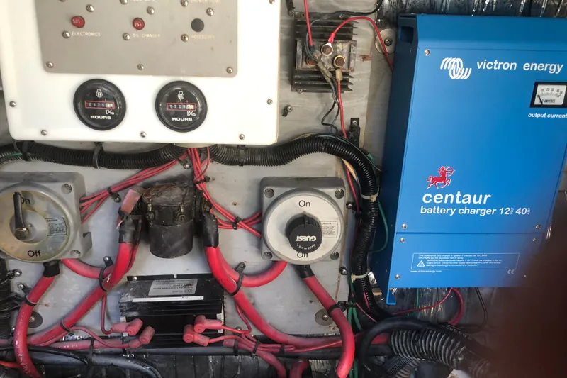 Slide: The Image of Engine room of 1990 Sea Ray 440 Express with Victron Energy battery charger. - 31