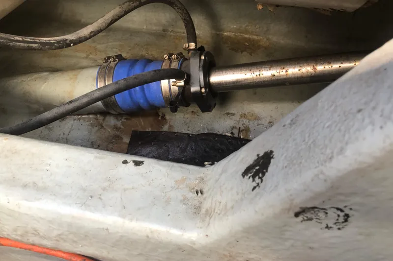 Slide: The Image of Boat shaft and hose in 1990 Sea Ray 440 Express engine compartment. - 32