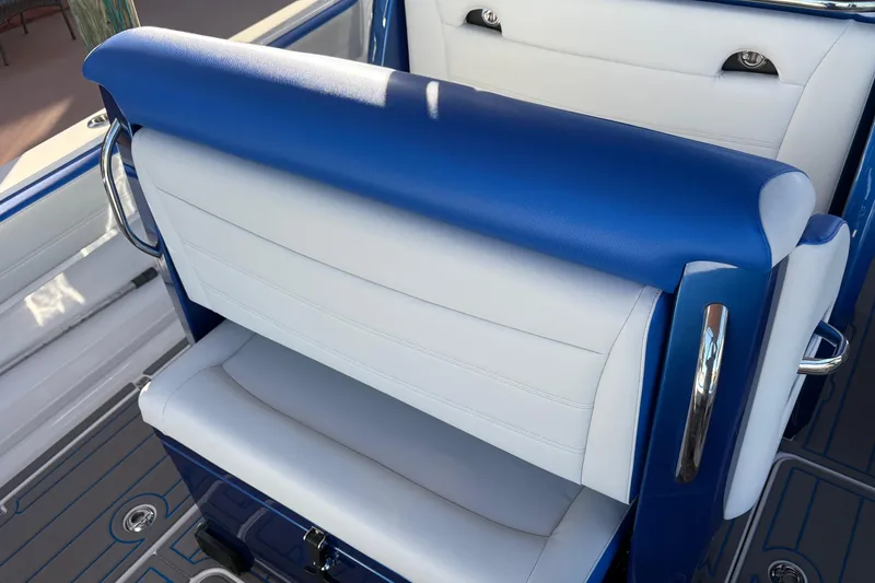 Slide: The Image of 2023 Nor-Tech 390 Sport Center Console, blue and white seating detail. - 19
