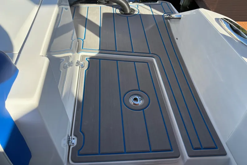 Slide: The Image of 2023 Nor-Tech 390 Sport Center Console deck with sleek design and blue accents. - 24