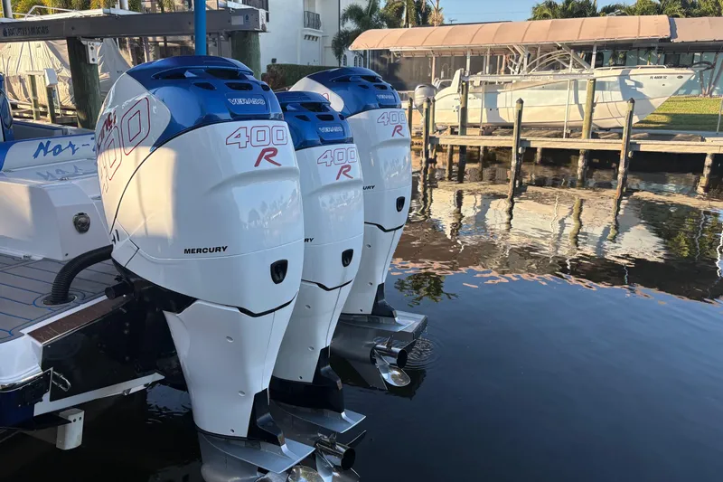 Slide: The Image of Triple Mercury 400R engines on a 2023 Nor-Tech 390 Sport Center Console boat. - 28
