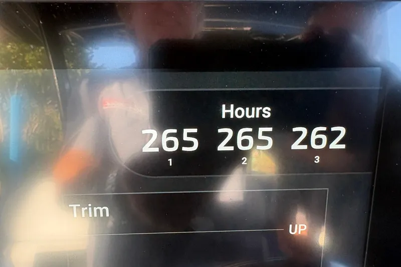 Slide: The Image of Display screen showing engine hours for Nor-Tech 390 Sport Center Console, 2023 model. - 30