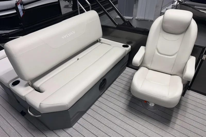 Slide: The Image of Luxurious seating on 2026 Sylvan Mirage 8520 CLZ DH pontoon boat, featuring plush white upholstery. - 14
