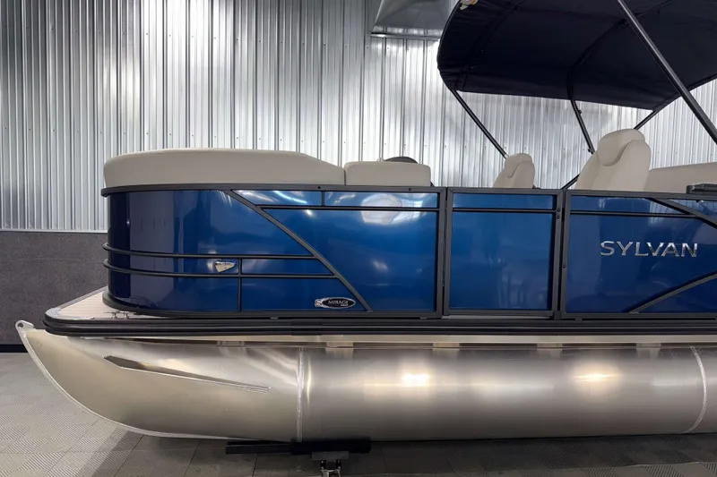 Slide: The Image of 2026 Sylvan Mirage 8520 CLZ DH pontoon boat with sleek blue design and comfortable seating. - 20