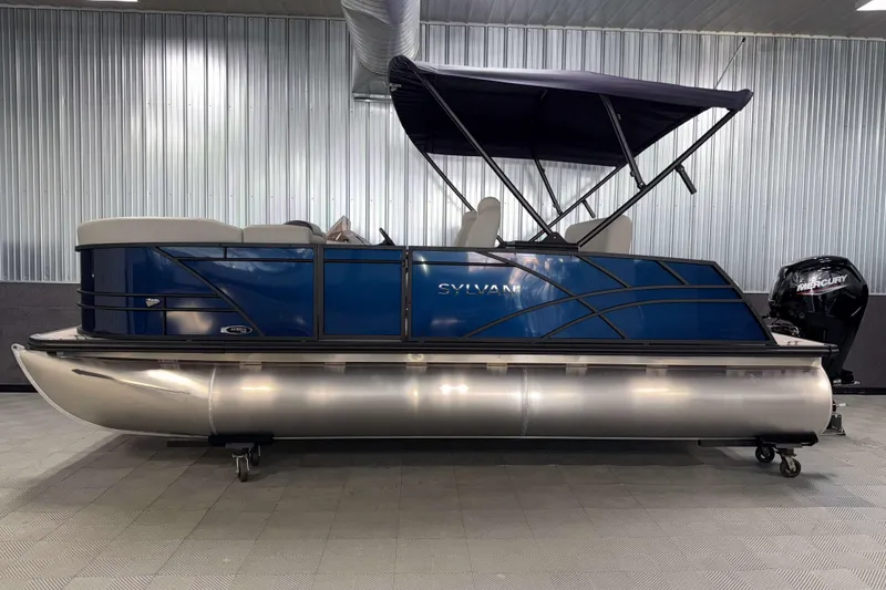 Slide: The Image of 2026 Sylvan Mirage 8520 CLZ DH pontoon boat with blue exterior and canopy. - 21