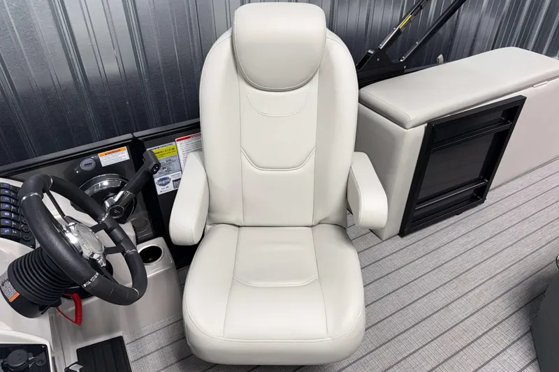 Slide: The Image of Captain's chair and steering wheel of 2026 Sylvan Mirage 8520 CLZ DH boat. - 8