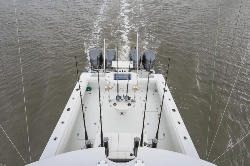 Slide: The Image of Aerial view of 2018 Freeman 37 VH boat with fishing rods and dual engines. - 10