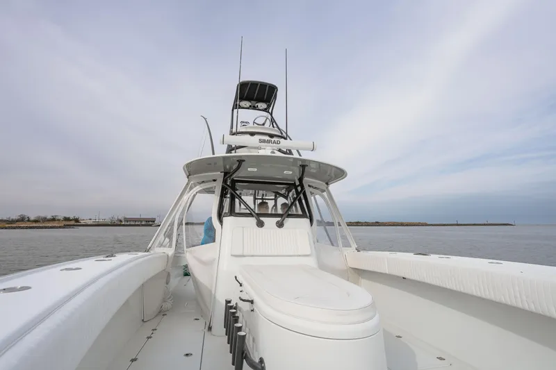 Slide: The Image of 2018 Freeman 37 VH boat on calm water under a cloudy sky. - 13