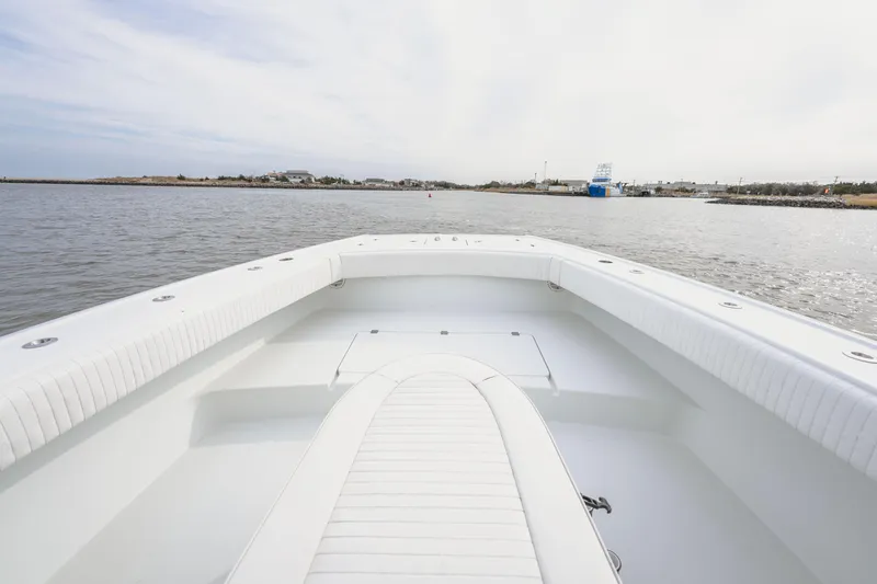 Slide: The Image of 2018 Freeman 37 VH boat on calm water, showcasing spacious deck and sleek design. - 14