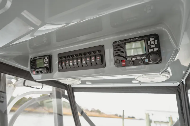 Slide: The Image of 2018 Freeman 37 VH boat dashboard with control panel and marine radio. - 21