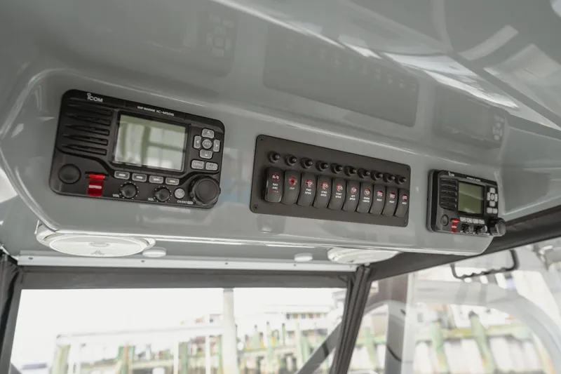 Slide: The Image of Control panel of a 2018 Freeman 37 VH boat with radio and switches. - 22