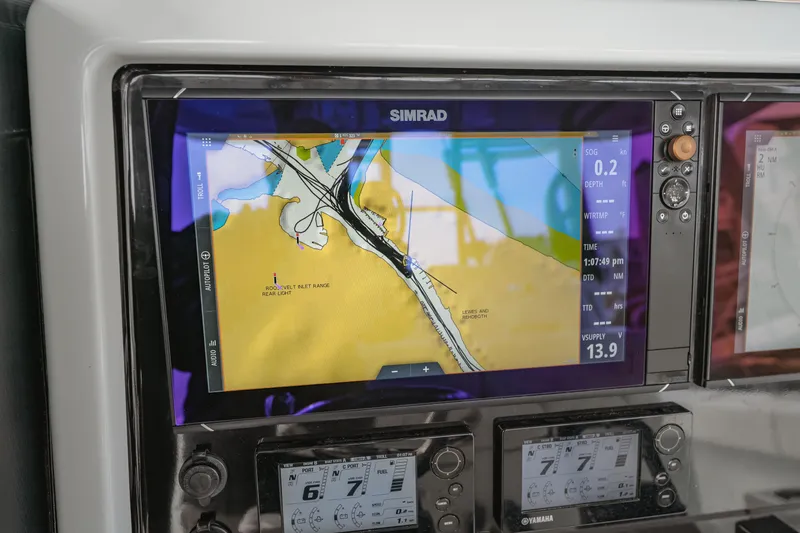 Slide: The Image of Simrad navigation display on a 2018 Freeman 37 VH boat, showing nautical chart and data. - 24