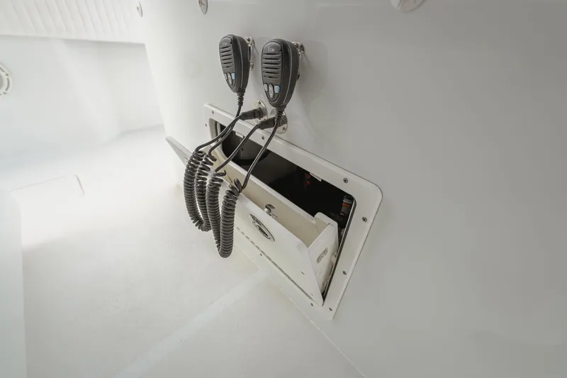 Slide: The Image of Two radio microphones in a compartment on a 2018 Freeman 37 VH boat. - 26