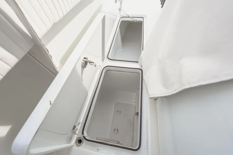 Slide: The Image of Open storage compartments on a 2018 Freeman 37 VH boat, showcasing interior space. - 29