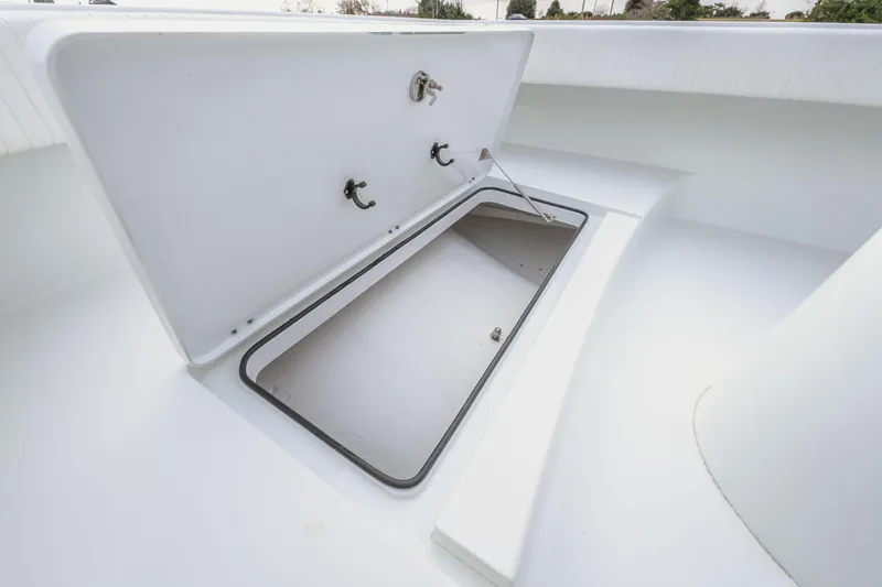 Slide: The Image of Open storage compartment on 2018 Freeman 37 VH boat, showcasing spacious interior. - 37