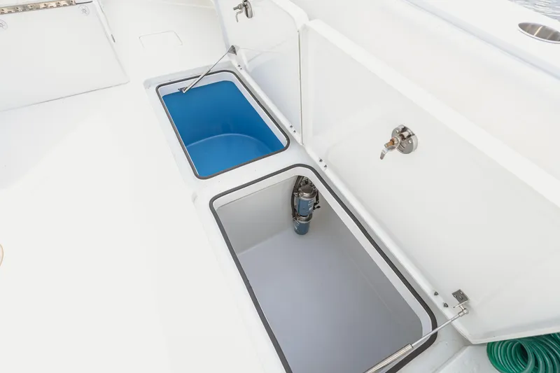 Slide: The Image of Open storage compartments on a 2018 Freeman 37 VH boat deck. - 38
