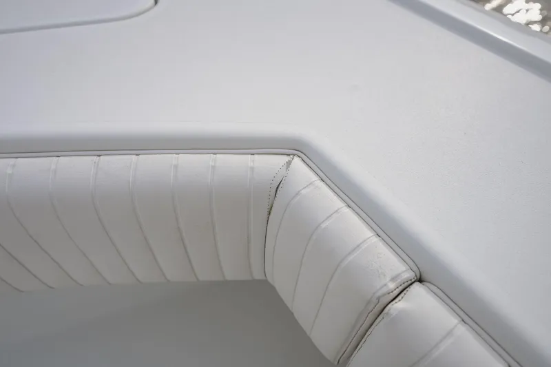Slide: The Image of Close-up of white cushioned seating on a 2018 Freeman 37 VH boat. - 40