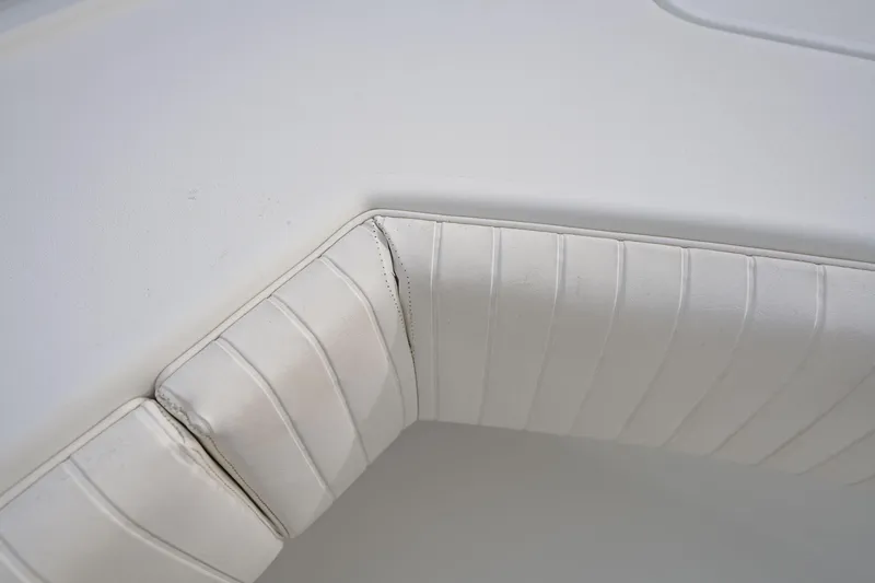 Slide: The Image of White cushioned seating on a 2018 Freeman 37 VH boat interior. - 41