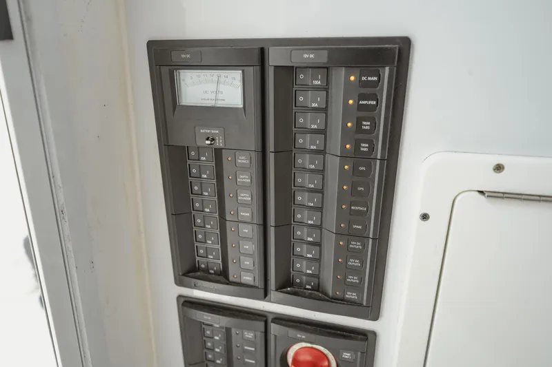 Slide: The Image of Electrical panel of a 2018 Freeman 37 VH boat, featuring various switches and a voltmeter. - 43