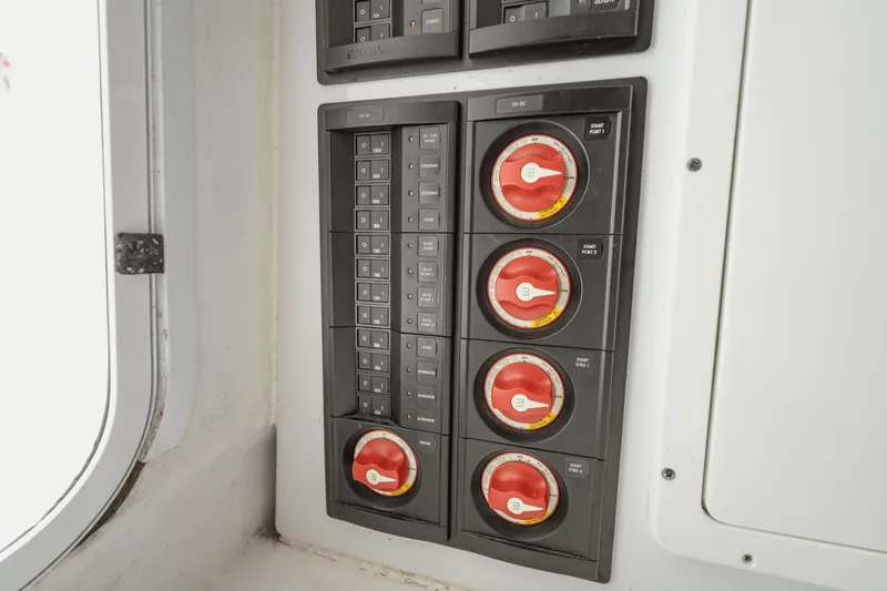 Slide: The Image of Control panel with switches and dials on a 2018 Freeman 37 VH boat. - 45