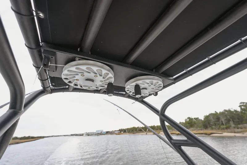 Slide: The Image of Freeman 37 VH 2018 boat with overhead rod holders on a calm waterway. - 8