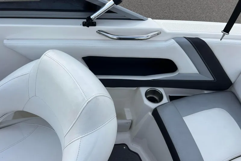 Slide: The Image of Interior of 2013 Larson LX 205S IO boat with white and gray seating. - 10