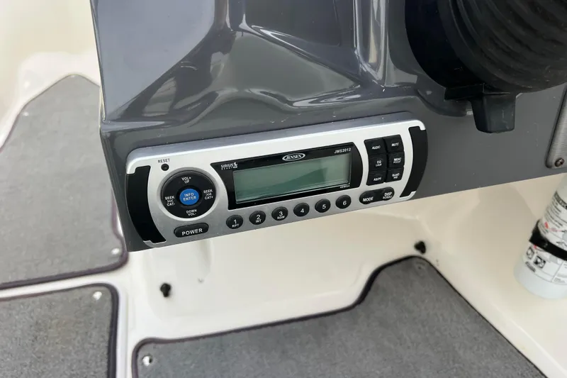 Slide: The Image of Boat stereo system on a 2013 Larson LX 205S IO dashboard. - 15