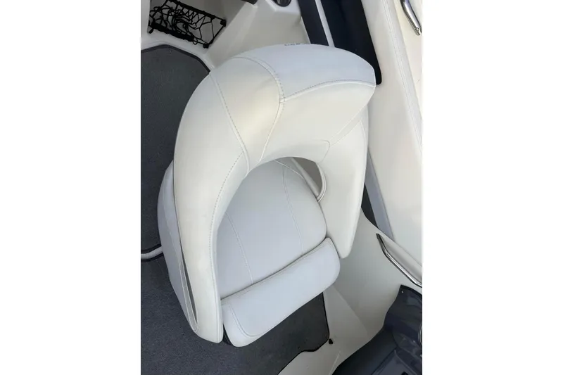 Slide: The Image of White leather seat in 2013 Larson LX 205S IO boat interior. - 18