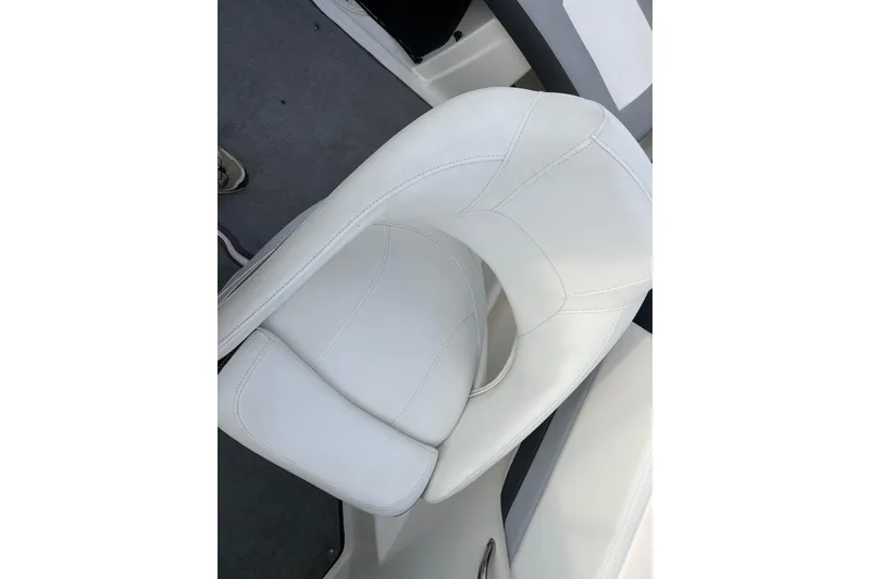 Slide: The Image of White leather seat in 2013 Larson LX 205S IO boat interior. - 19