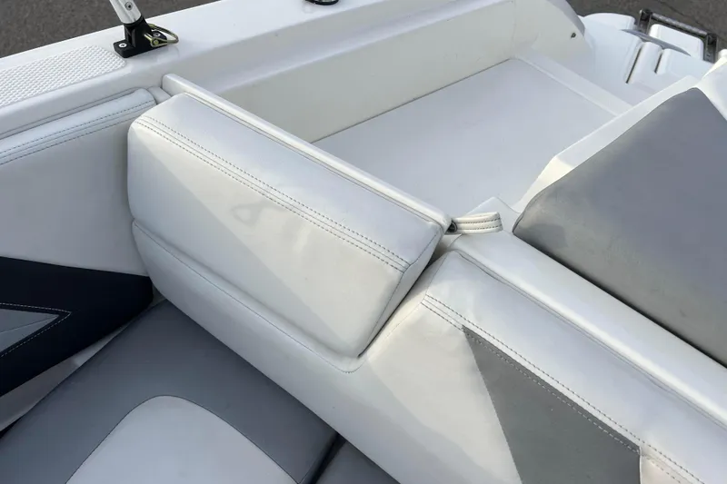 Slide: The Image of 2013 Larson LX 205S IO boat interior with white and gray seating. - 26