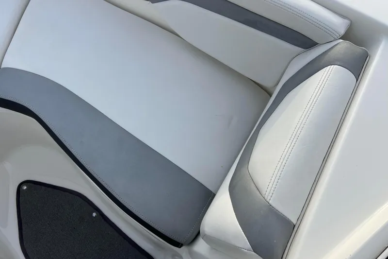 Slide: The Image of 2013 Larson LX 205S IO boat seat with gray and white upholstery. - 27
