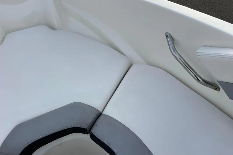 Slide: The Image of White and gray seating area on a 2013 Larson LX 205S IO boat. - 28