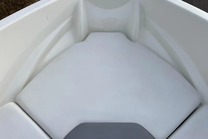 Slide: The Image of 2013 Larson LX 205S IO boat interior, featuring white cushioned seating area. - 29