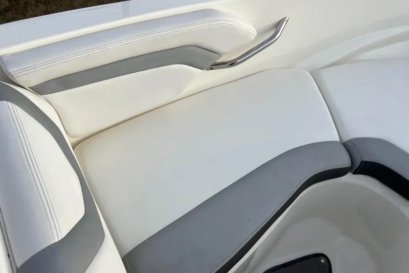 Slide: The Image of White and gray seating on 2013 Larson LX 205S IO boat, featuring sleek design and comfort. - 30