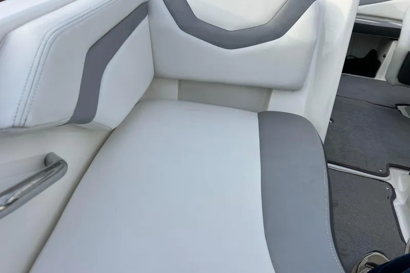 Slide: The Image of 2013 Larson LX 205S IO boat interior with white and gray seating. - 31