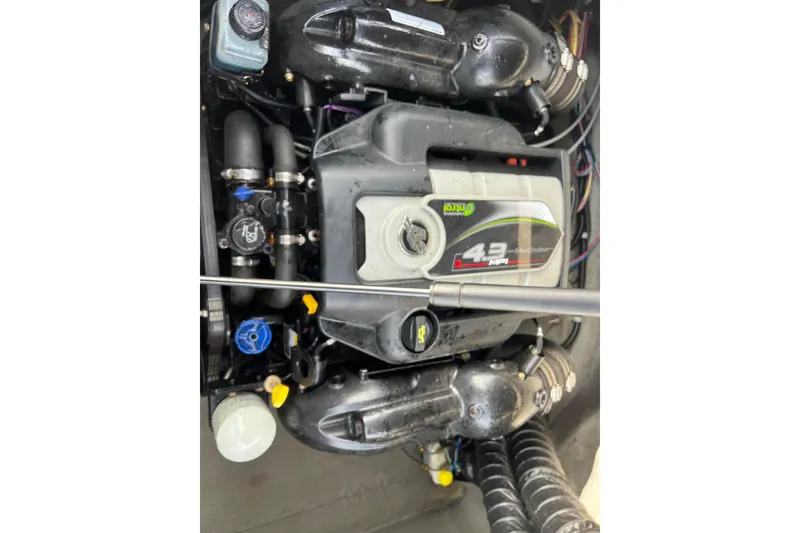 Slide: The Image of Engine of 2013 Larson LX 205S IO boat, featuring a 4.3 MPI MerCruiser. - 34