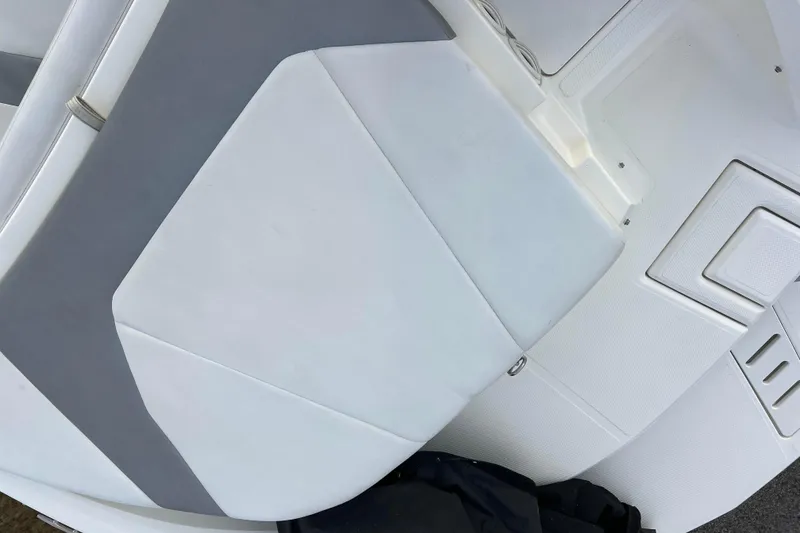 Slide: The Image of 2013 Larson LX 205S IO boat interior with white and gray seating. - 37