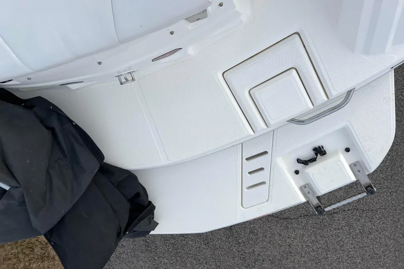 Slide: The Image of Rear deck of a 2013 Larson LX 205S IO boat with swim platform and ladder. - 38