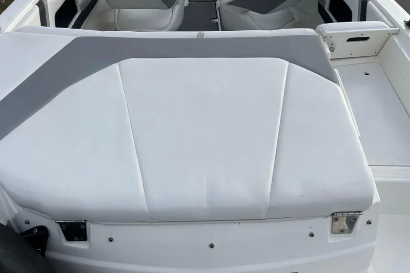 Slide: The Image of 2013 Larson LX 205S IO boat interior with white and gray seating. - 39