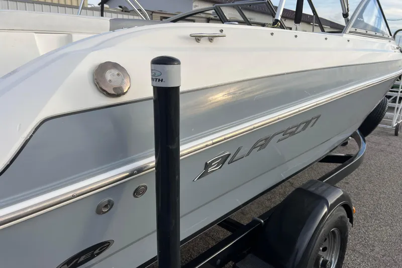 Slide: The Image of 2013 Larson LX 205S IO boat on trailer, side view. - 41