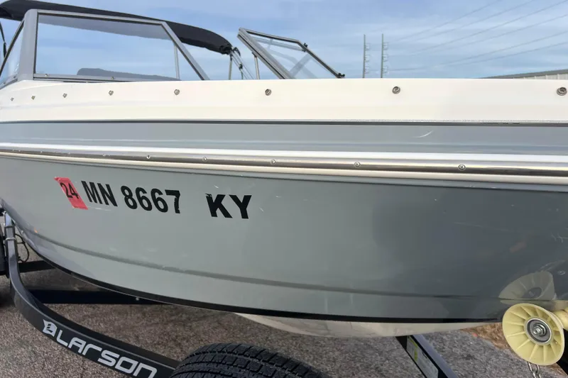 Slide: The Image of 2013 Larson LX 205S IO boat on trailer, registration MN 8667 KY. - 45