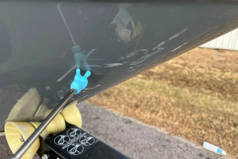 Slide: The Image of 2013 Larson LX 205S IO boat hull with blue plug and roller detail. - 46