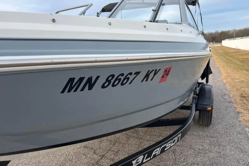 Slide: The Image of 2013 Larson LX 205S IO boat on trailer, registration MN 8667 KY. - 49