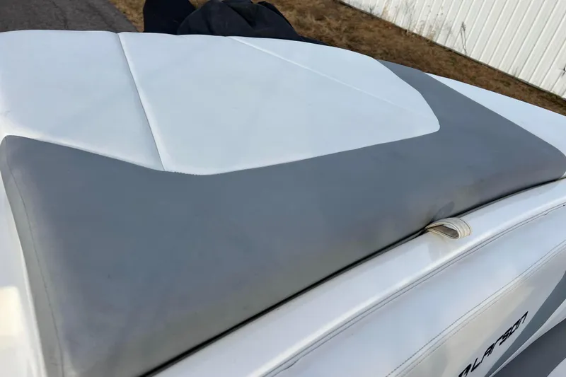 Slide: The Image of 2013 Larson LX 205S IO boat with gray and white upholstery detail. - 9